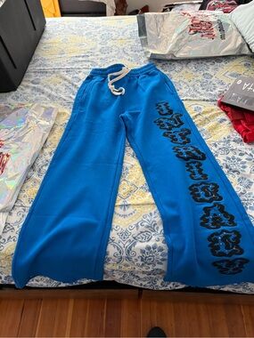 Lost Intricacy Men’s Bright Blue Sweatpants with Black Side Graphic